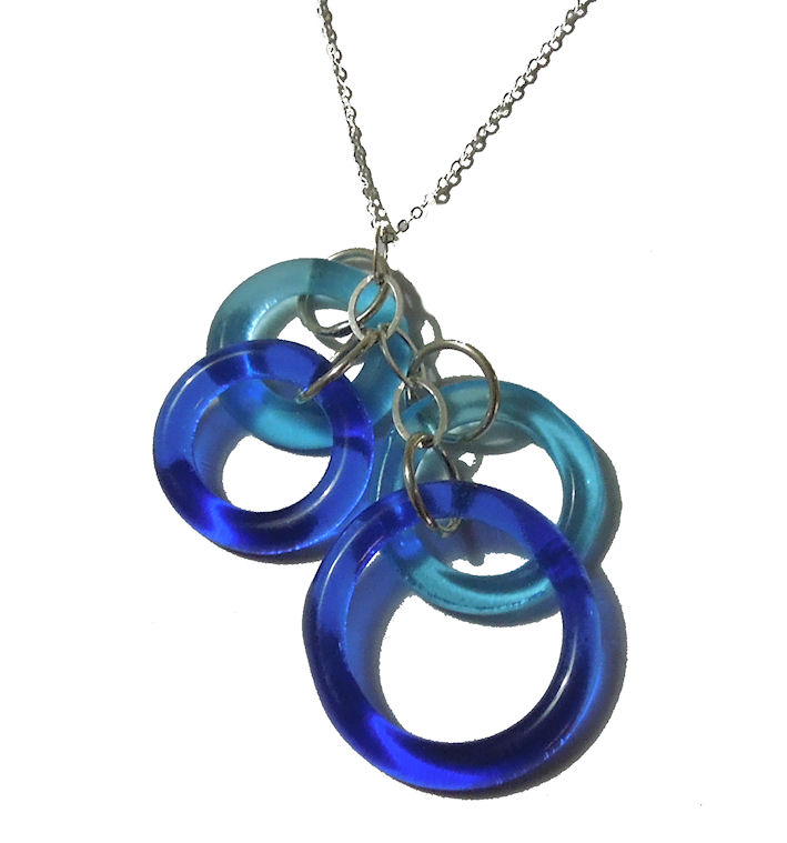  A cluster of four blue glass rings on a silver chain as an environmentally friendly gift idea.