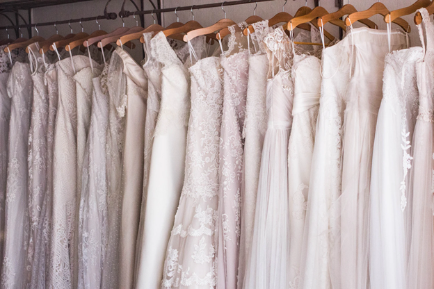 A rack of multiple ethical wedding dresses